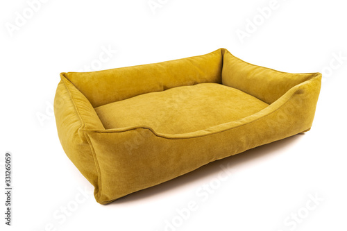Yellow soft small dog or cats bed. Angle view.
