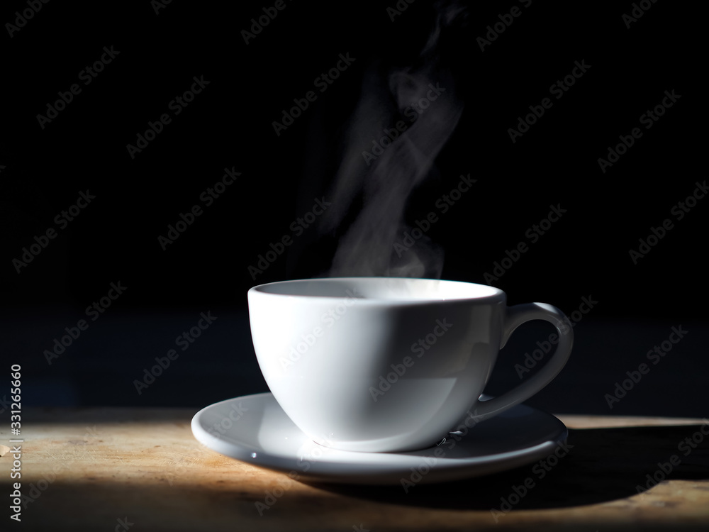 hot coffee cup and Smoke on black background hot coffee cup and Smoke on black background