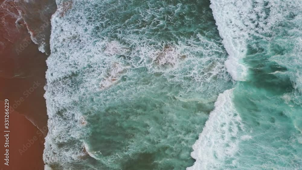 Praia Do Tonel Portugal splashing strong ocean waves, Aerial top view shot Praia Do Tonel Portugal splashing strong ocean waves, Aerial top view shot