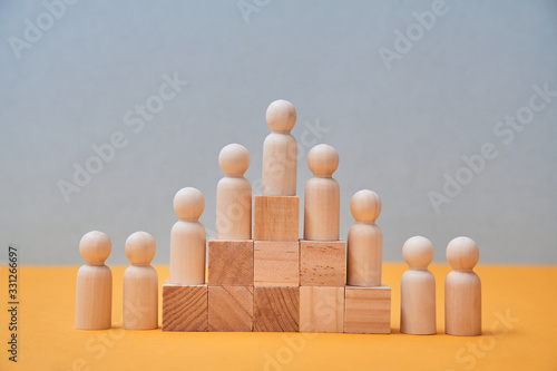 Human resource, Talent management, Recruitment employee, Successful business team leader. Figures on wooden pyramid