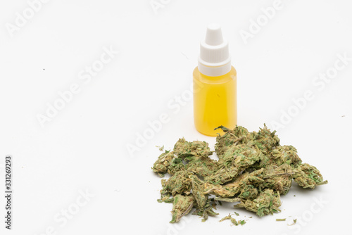 Marijuana cannabis Medicinal, weed joint In a glass container. Medical extract of cannabis marijuana oil in jar