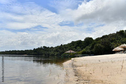 Fototapeta Naklejka Na Ścianę i Meble -  sandy beach on one of the tributaries in the Amazon in Brazil