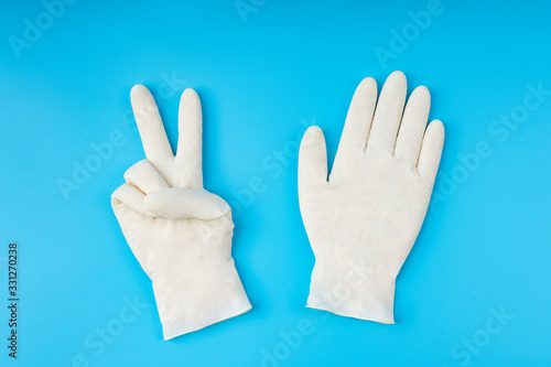 Wallpaper Mural White latex gloves pattern. Protection concept. With proper protection you beat the virus. Torontodigital.ca