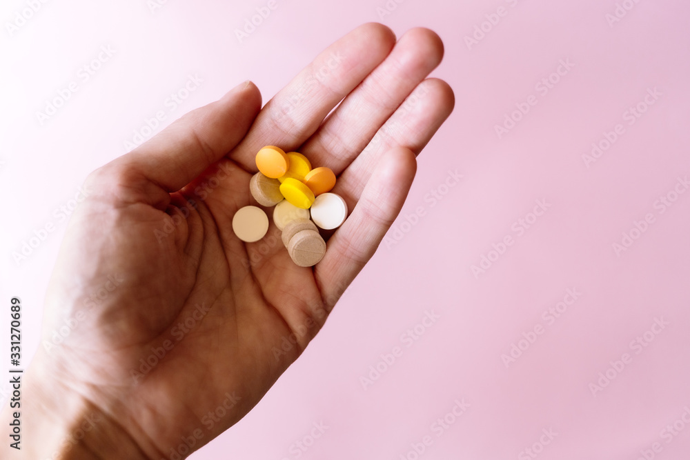 Capsules and tablets lie on the palm of your hand Capsules and tablets lie on the palm of your hand