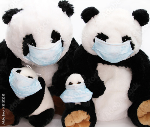 Funny quarantined toys in medical masks - family protection against viruses, bacteria, germs