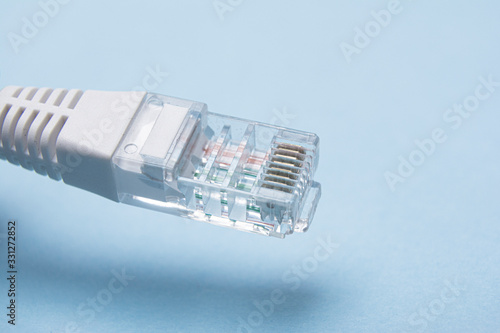 Close up of network cable on a blue background photo