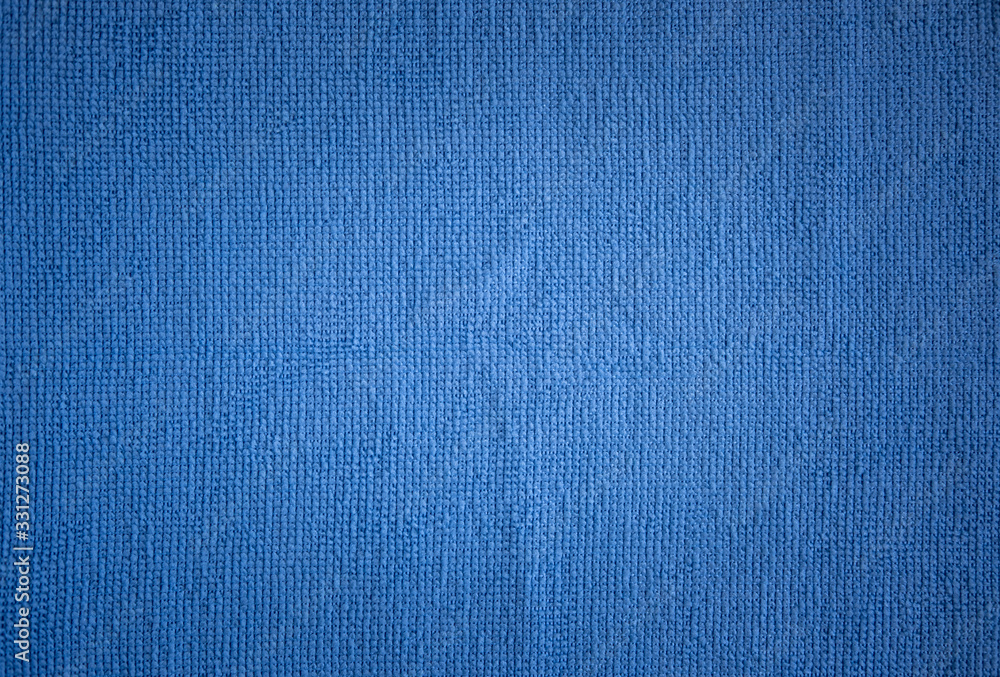 Textural background of light blue towels (rags). The center is a little lighter and darker towards the edges. Textural background of light blue towels (rags). The center is a little lighter and darker towards the edges.