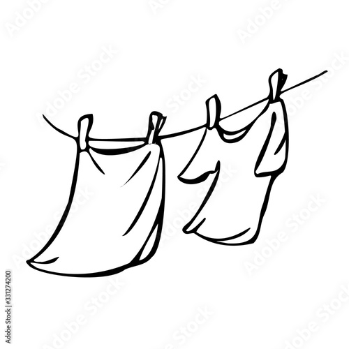 Towel and T-shirt are dried on a clothesline. Vector illustration in line art style. Isolated on a white background.