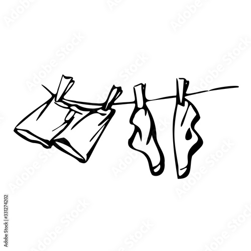 Socks and shorts are dried on a clothesline. Vector illustration in line art style. Isolated on a white background.