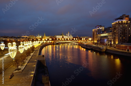 Moscow, Russia - January 10, 2020: Evening view of the Moscow Kremlin, Prechistenskaya and Bersenevskaya embankments with festive illumination photo