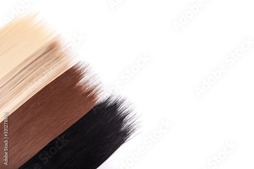 Long hair extensions in natural colors. Black, brown, blonde, and blonde balayage.