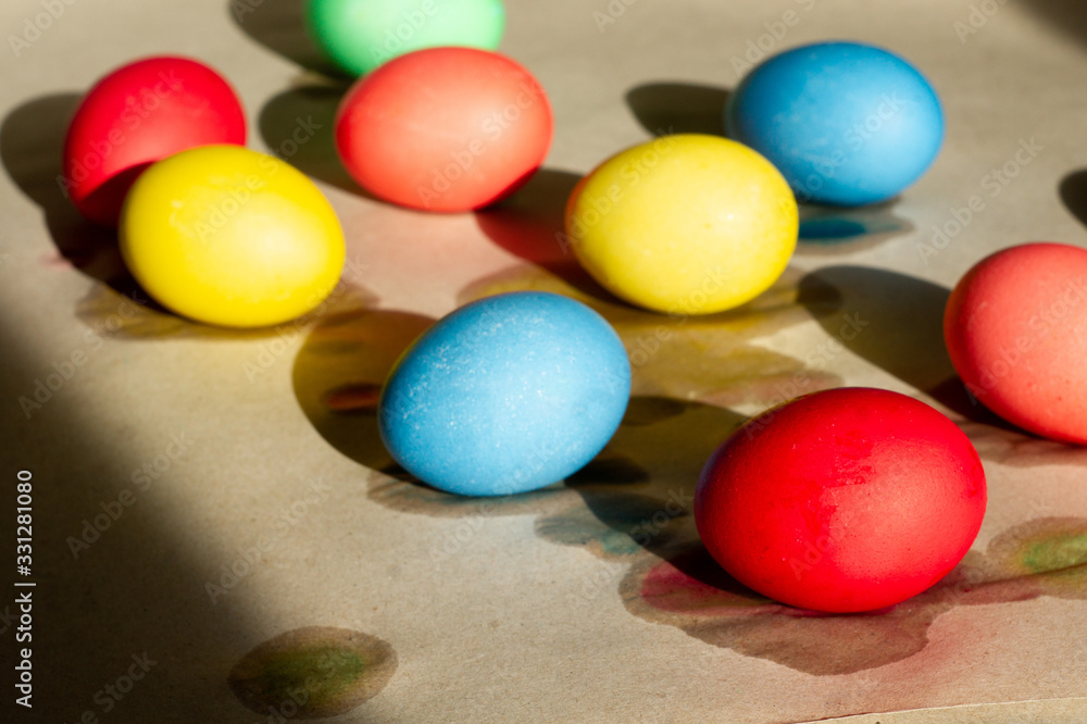 Set of wet-paint homemade colorful Easter eggs on parchment paper. Spring holiday symbols. Christian gift. Set of wet-paint homemade colorful Easter eggs on parchment paper. Spring holiday symbols. Christian gift.