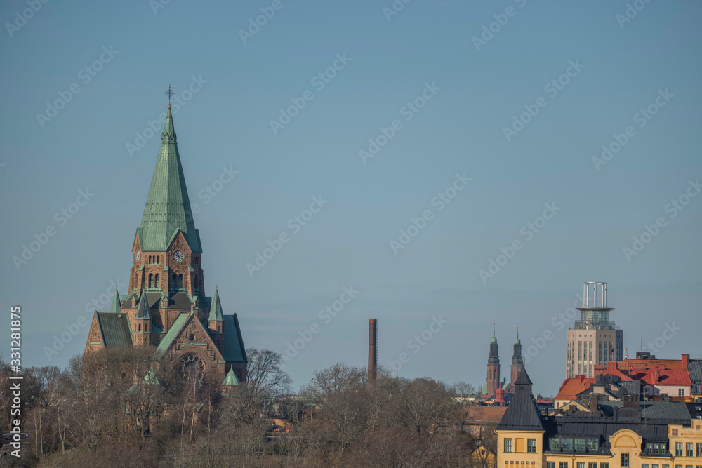 Sky line over the district Södermalm with the church Sofia kyrka and the tower at Medborgarplatsen and the church Högalidskyrkan in the background