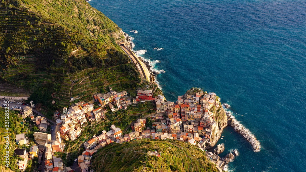 Village of Manarola in aerial view, Cinque Terre coast of Italy. Manarola is a small town in the province of La Spezia, in Liguria, in northern Italy and one of the Cinque Terre attractions for touris