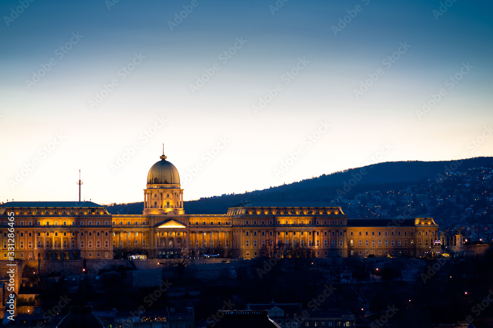 View of Buda Castle on the side of Bude at night. Budapest, Hungary. Blue hour photo