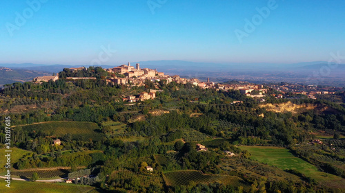 Authentic village of Montepulciano. A beautiful old town with red roofs in Tuscany, Italy. Perfect for travels and vacations - aerial view with a drone 