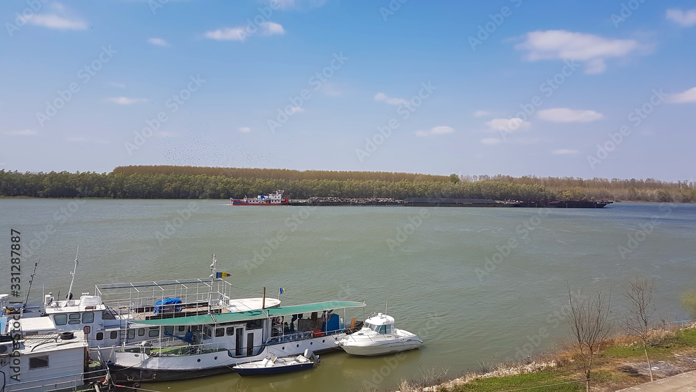 Fototapeta premium old barge.cargo boat transporting old iron. industrial concept