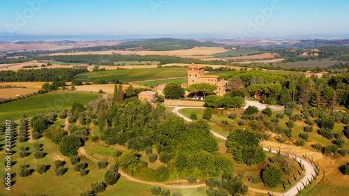Magnificent authentic Italian villa under the sun. The house is surrounded by green meadows. Aerial view with a drone in Tuscany  Italy