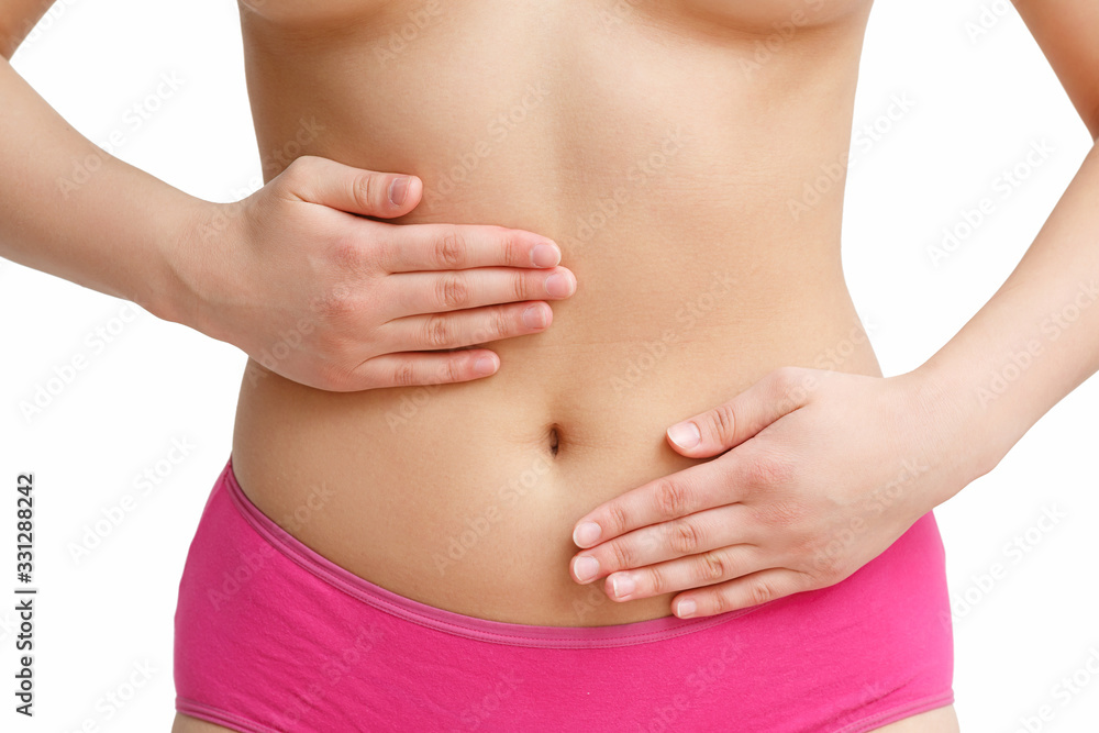 Woman massaging pain stomach isolated on white background Woman massaging pain stomach isolated on white background
