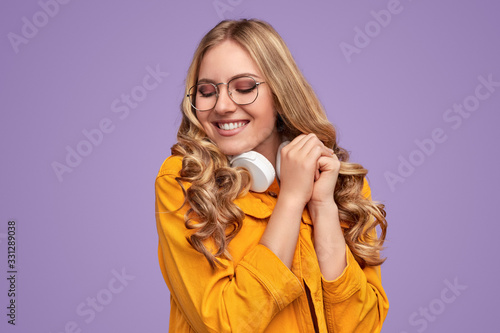 Delighted young woman with closed eyes