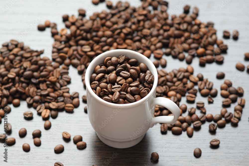 coffee beans in Cup on wood background coffee beans in Cup on wood background