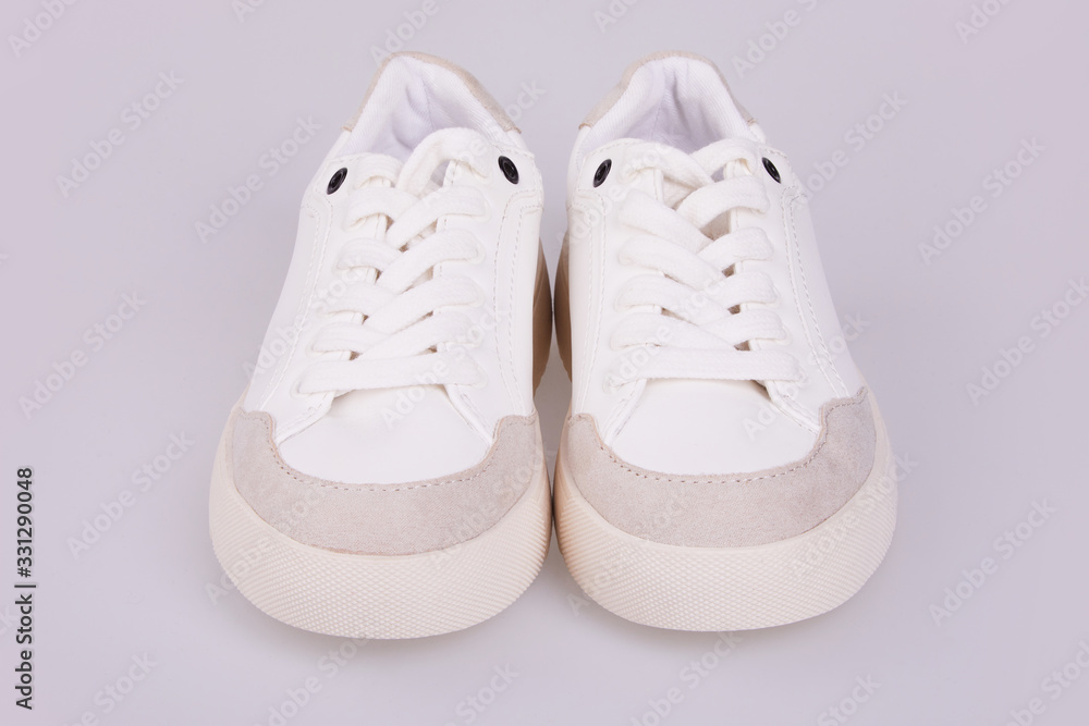  Fashionable white thick sole leather Sneakers on laces isolated on white background