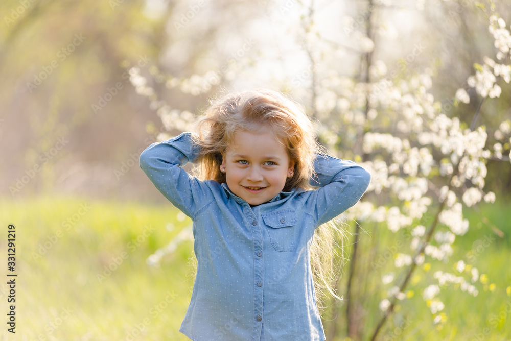 Little girl with beautiful thick hair has fun in the park. Little girl with beautiful thick hair has fun in the park.