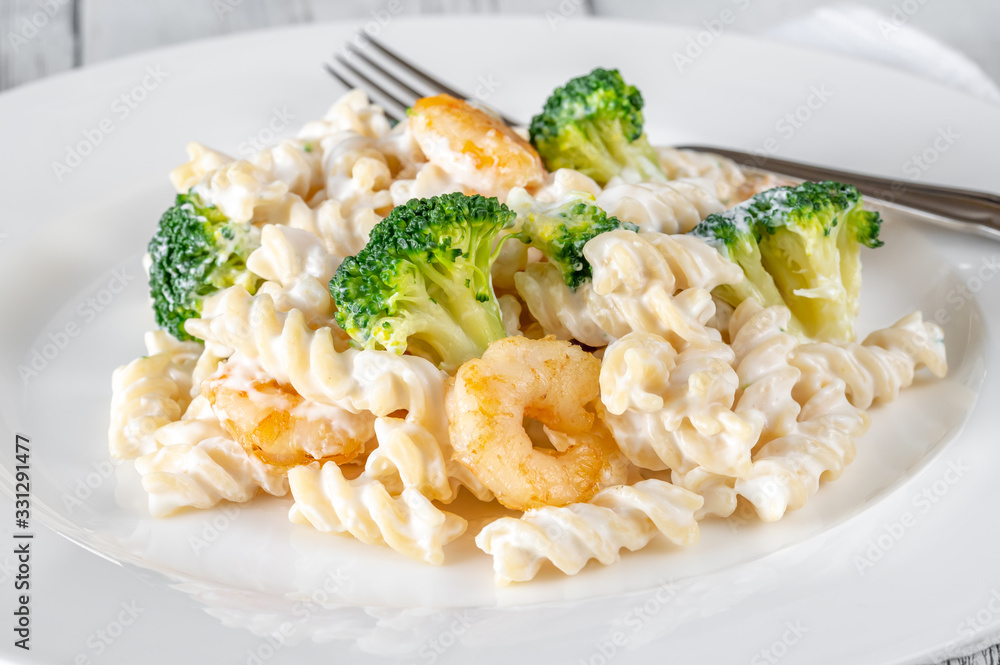 Fusilli pasta with broccoli, shrimps and creamy sauce Fusilli pasta with broccoli, shrimps and creamy sauce