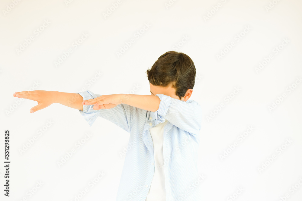 Boy with blue shirt making dab gesture Boy with blue shirt making dab gesture