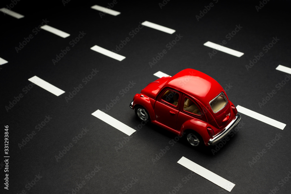 Upper view of Red toy car on a road with road lanes Stock Photo | Adobe ...