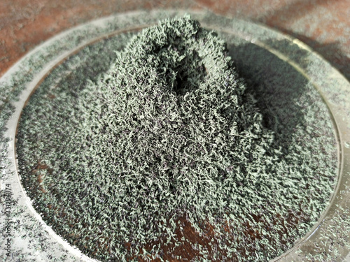 A pile of green powdery substance, chromium oxide, a chemical reaction product of a volcano.