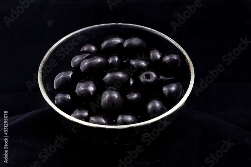 Tableau sur toile black olives in a glass bowl