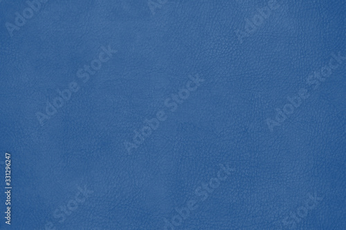Leather texture background surface  toned in trendy color 2020 year classic blue. Close-up.