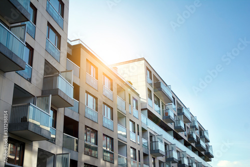 Modern apartment building exterior concept. Sunshine sun flare. © Grand Warszawski