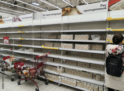 Nearly empty store shelves in the groats department of the supermarket