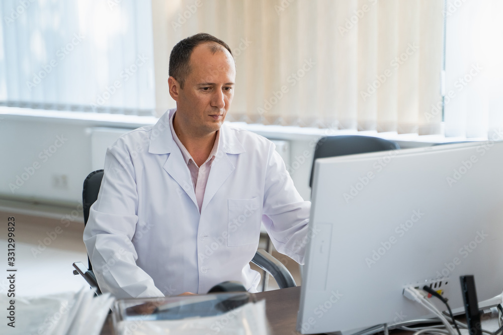 doctor working with computer in office doctor working with computer in office
