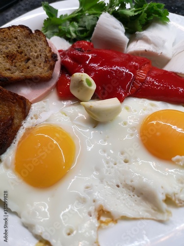 fried eggs with bacon and bacon