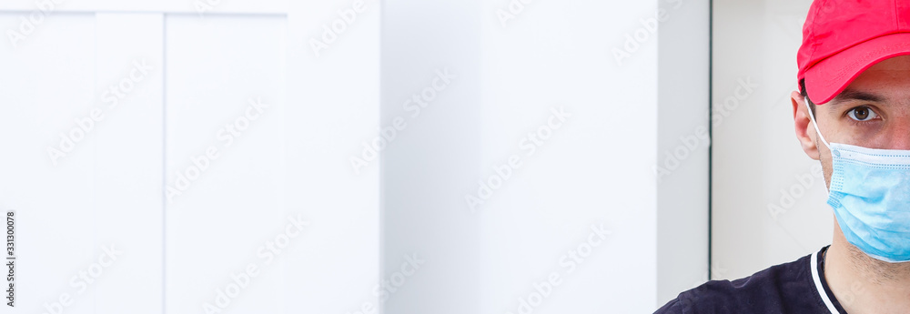 Person in medical face mask, guy has the flu, half face, portrait, closeup, white background, copy space Person in medical face mask, guy has the flu, half face, portrait, closeup, white background, copy space