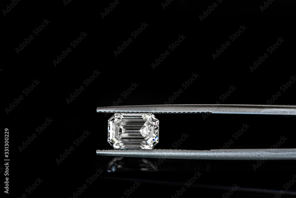 Emerald Cut Diamond in Tweezers Emerald Cut Diamond in Tweezers