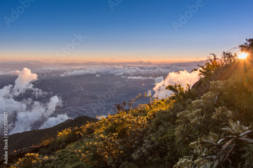 Sunrise over Caracas seen from Pico Naiguata El Avila National Park photo