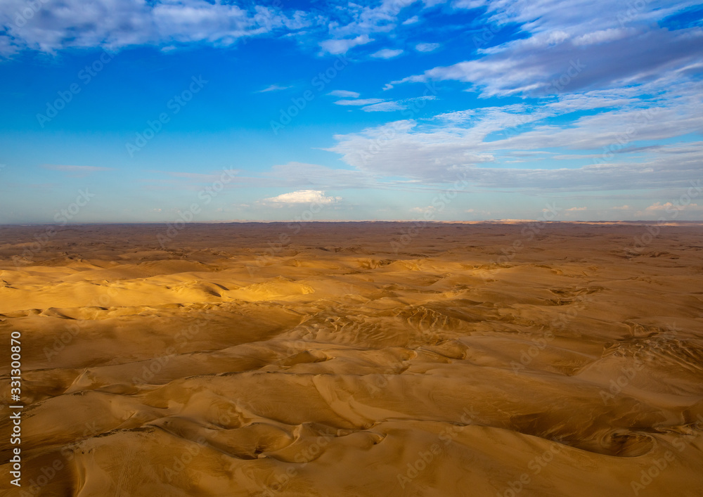Fototapeta premium Aerial picture of the landscape of the Namib Desert and the Atlantic Ocean on the Skeleton Coast in western Namibia