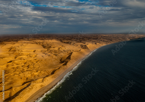 Aerial picture of the so called Great Wall at the Atlantic Ocean on the Skeleton Coast in western Namibia photo