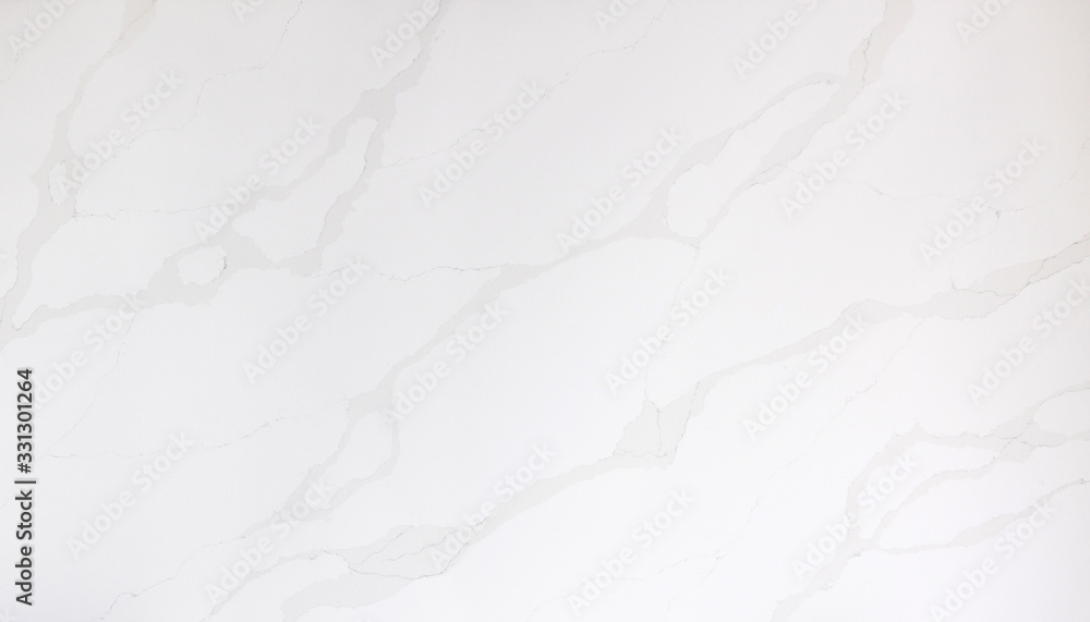Obraz premium Beautiful closeup of a white marble looking quartz slab with grey veining