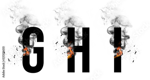 Fotografija Burning black letters G, H, I