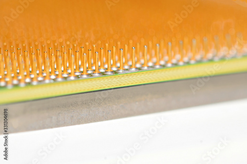 Central processor unit. Golden pins of a core. Copy space. Shallow depth of field. Close-up.