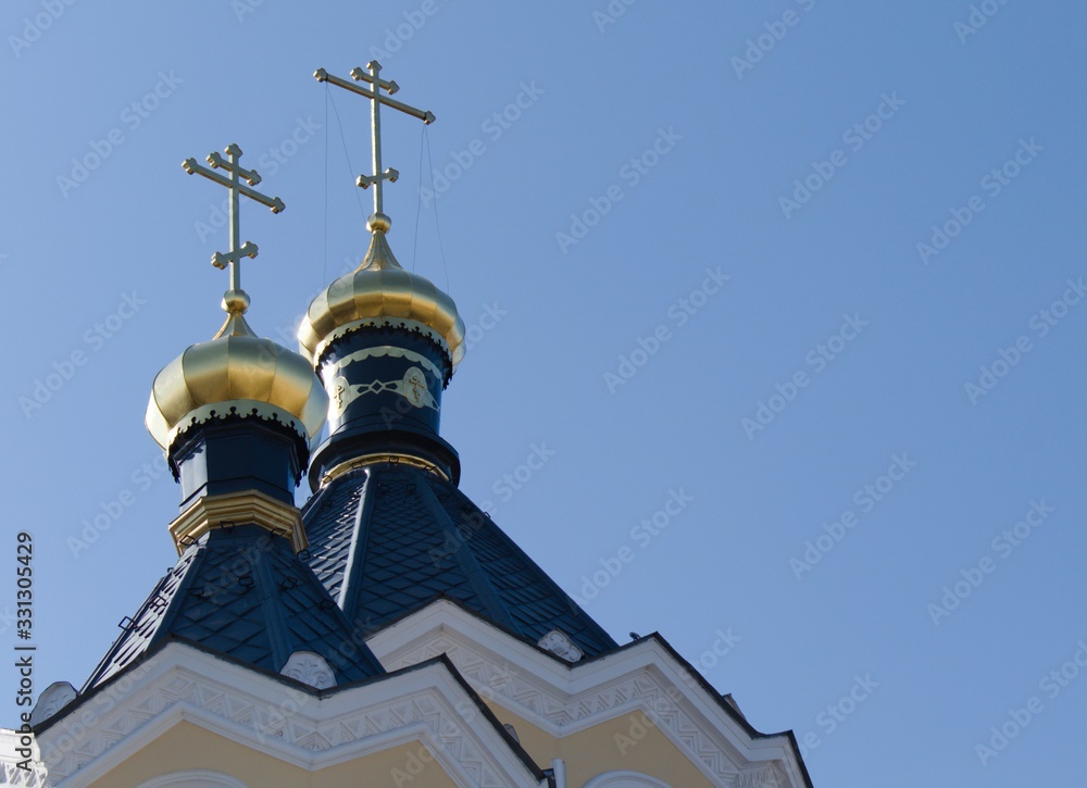 domes with crosses of the orthodox church on blue sky background