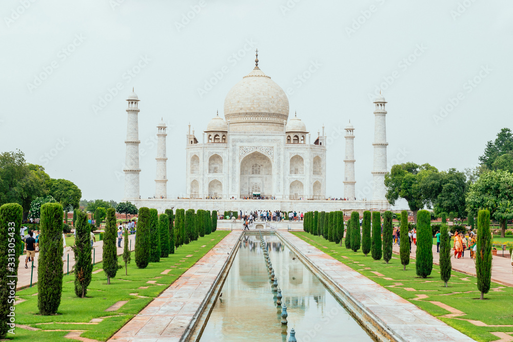 A perspective view on Taj-Mahal mausoleum with reflection in water