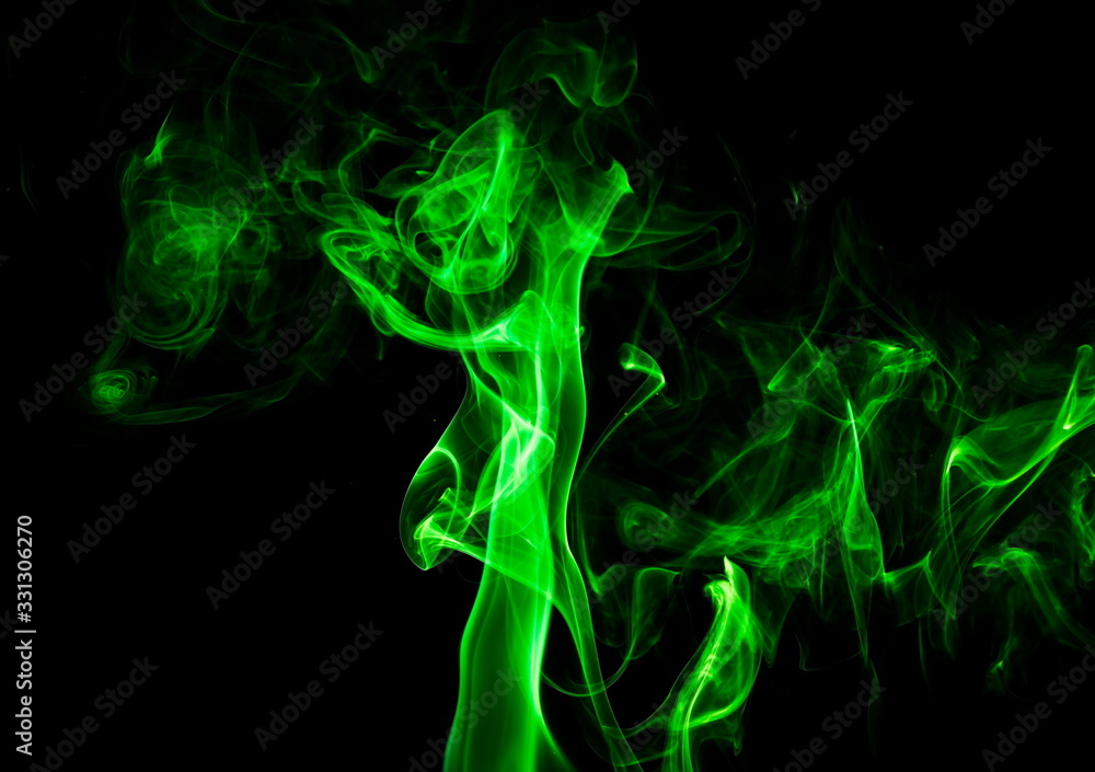 Fototapeta premium Green smoke on black background