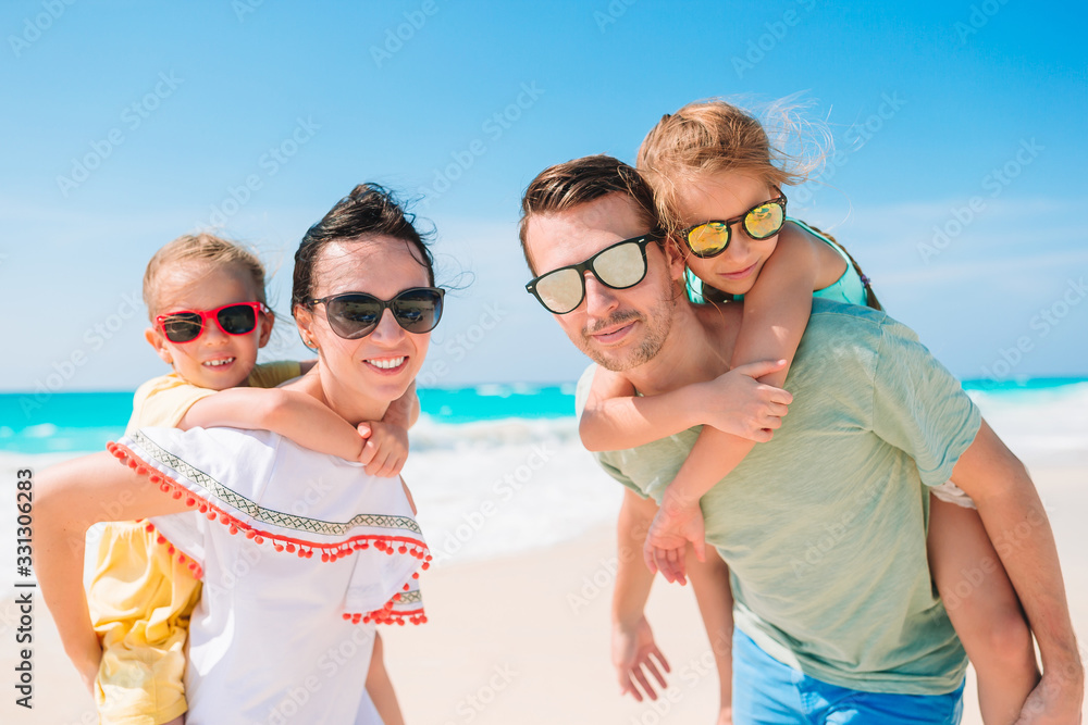 Young family with two kids on beach vacation