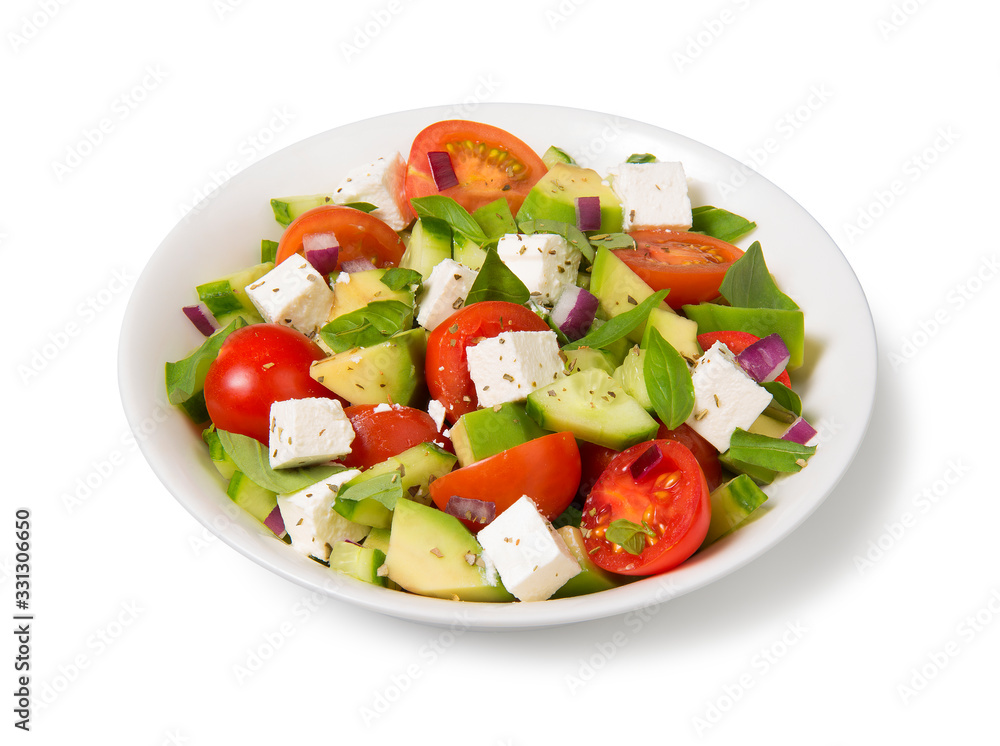 Salad with tomato, avocado, cucumber and feta cheese in a white bowl isolated on white background. Salad with tomato, avocado, cucumber and feta cheese in a white bowl isolated on white background.